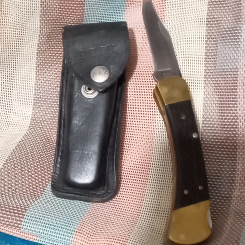 Buck knife and leather Buck case. And a multipurpose tool that you will love.